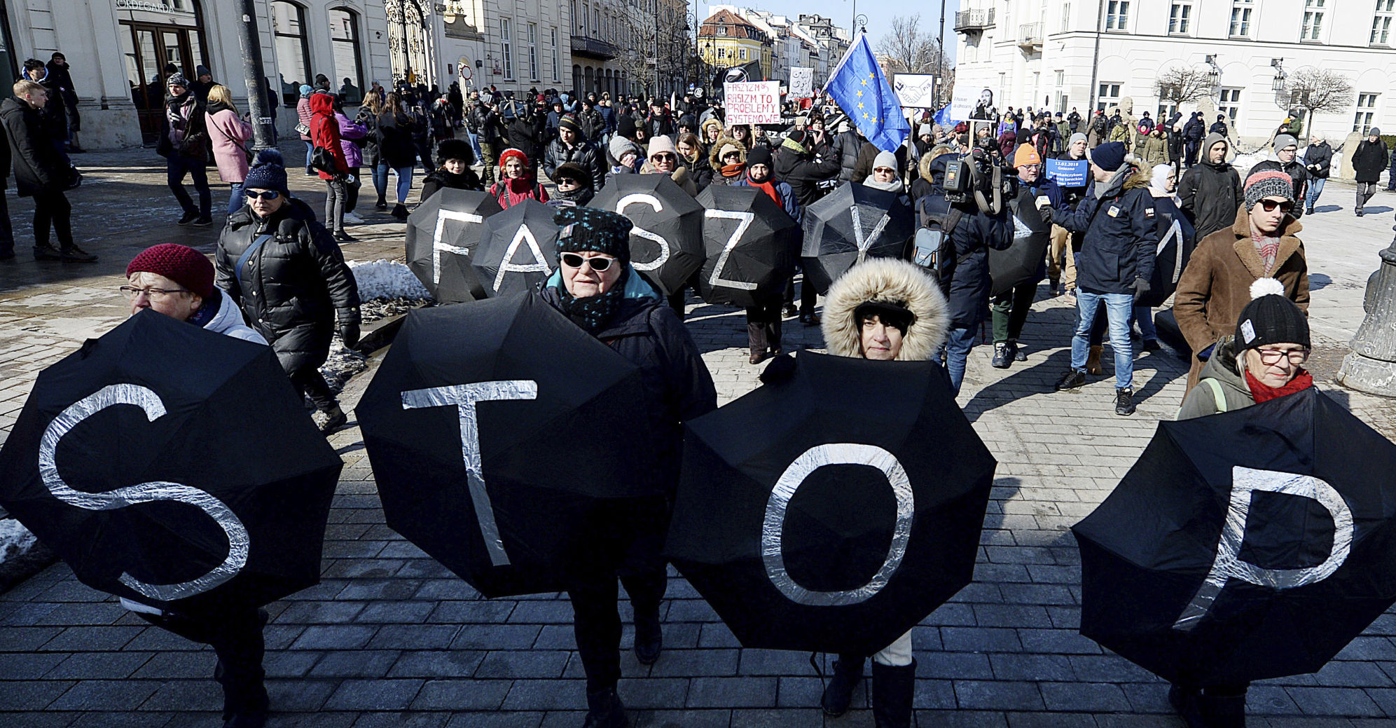 Warsaw residents with anti-racism banners protests